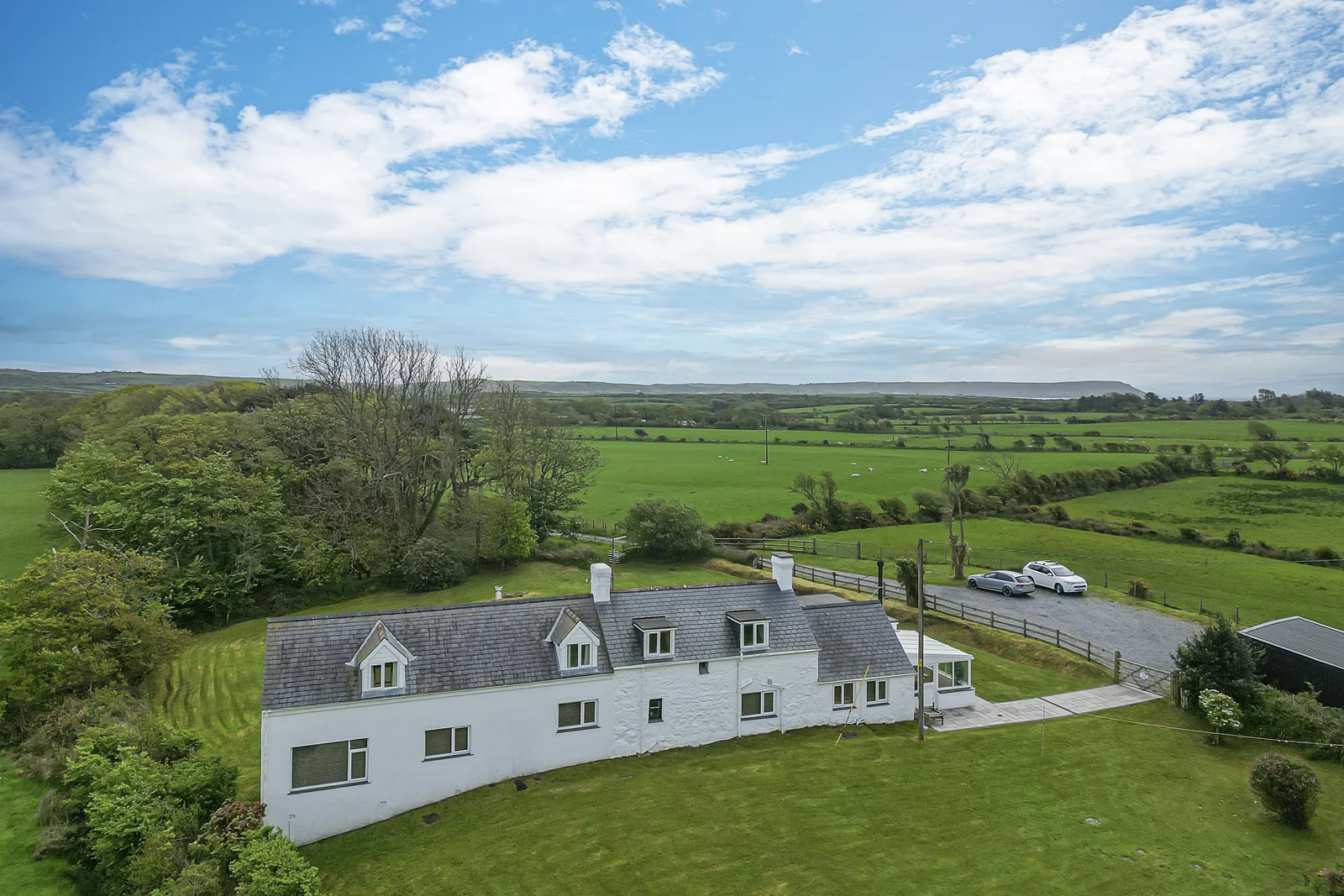 The historic stone farmhouse at Tyn y Big Estate