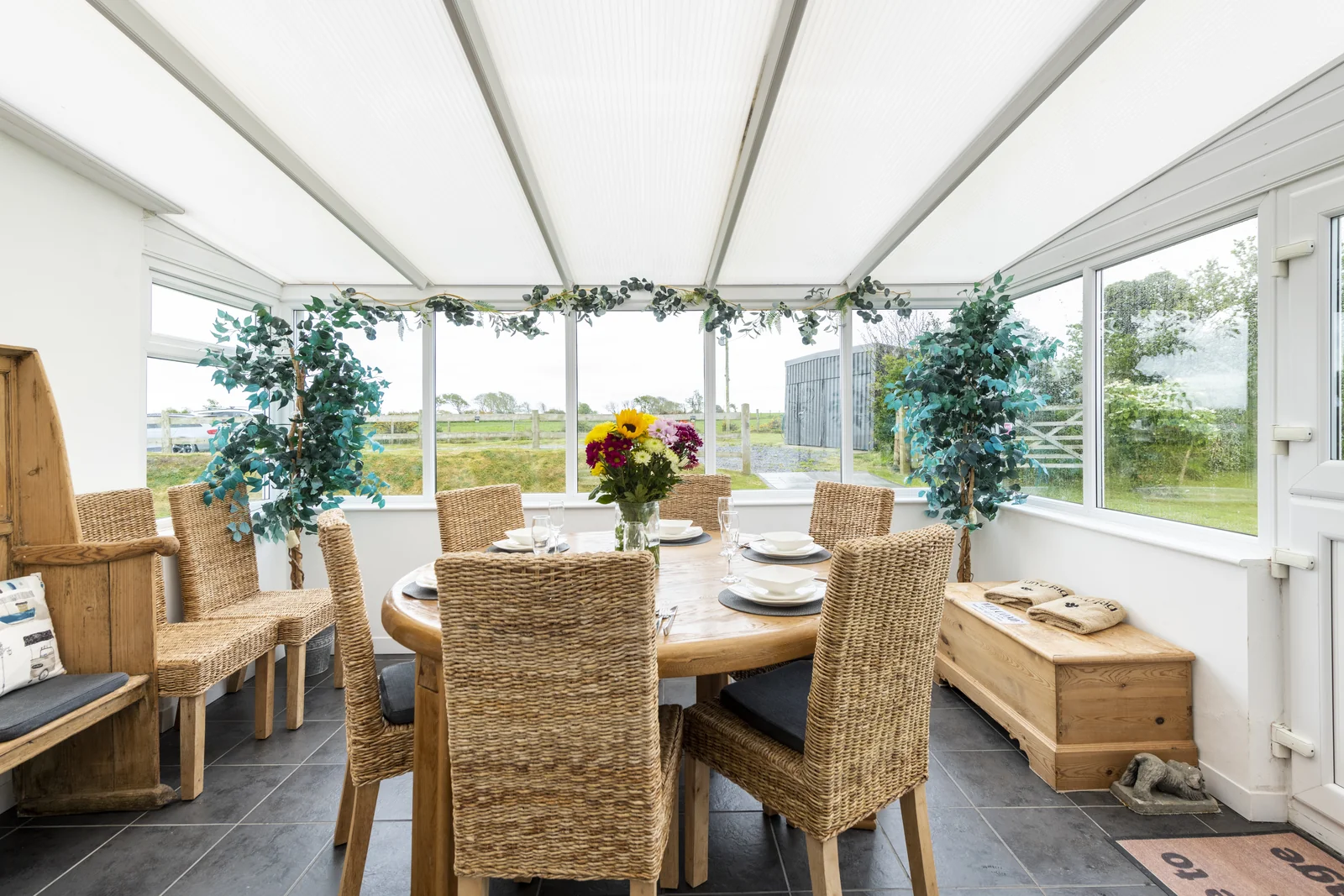 Conservatory dining area overlooking the gardens