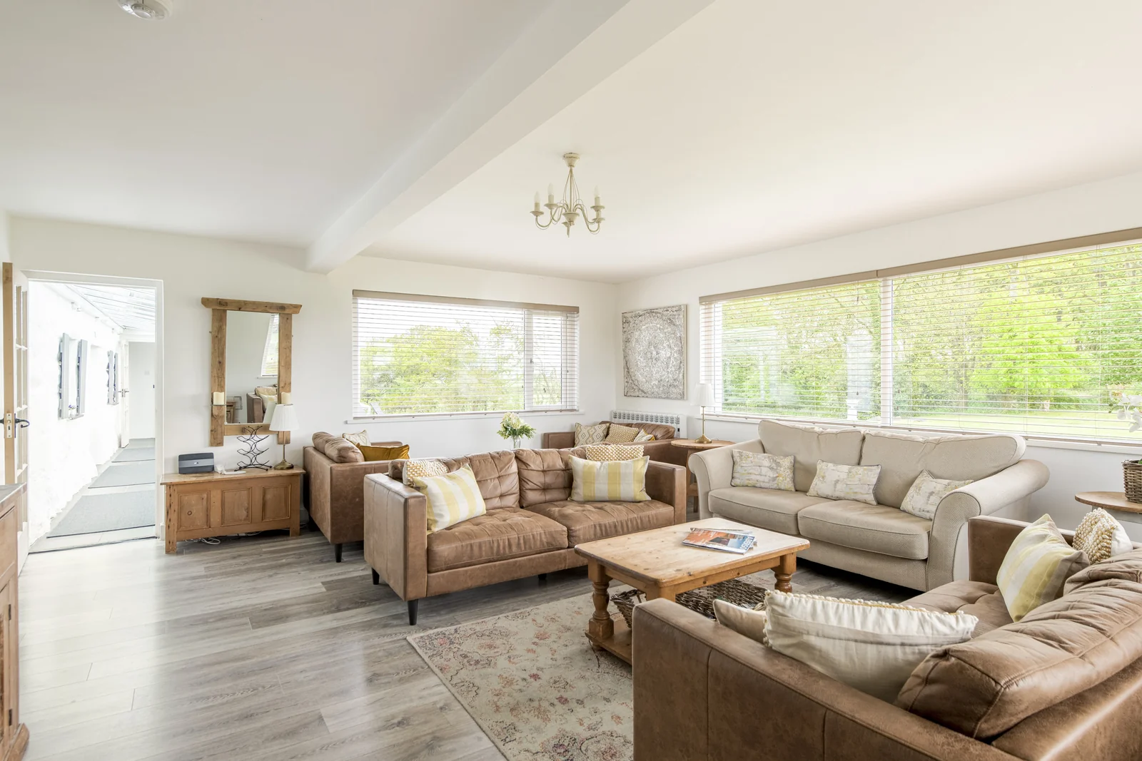 Main lounge with log burner and deep seating