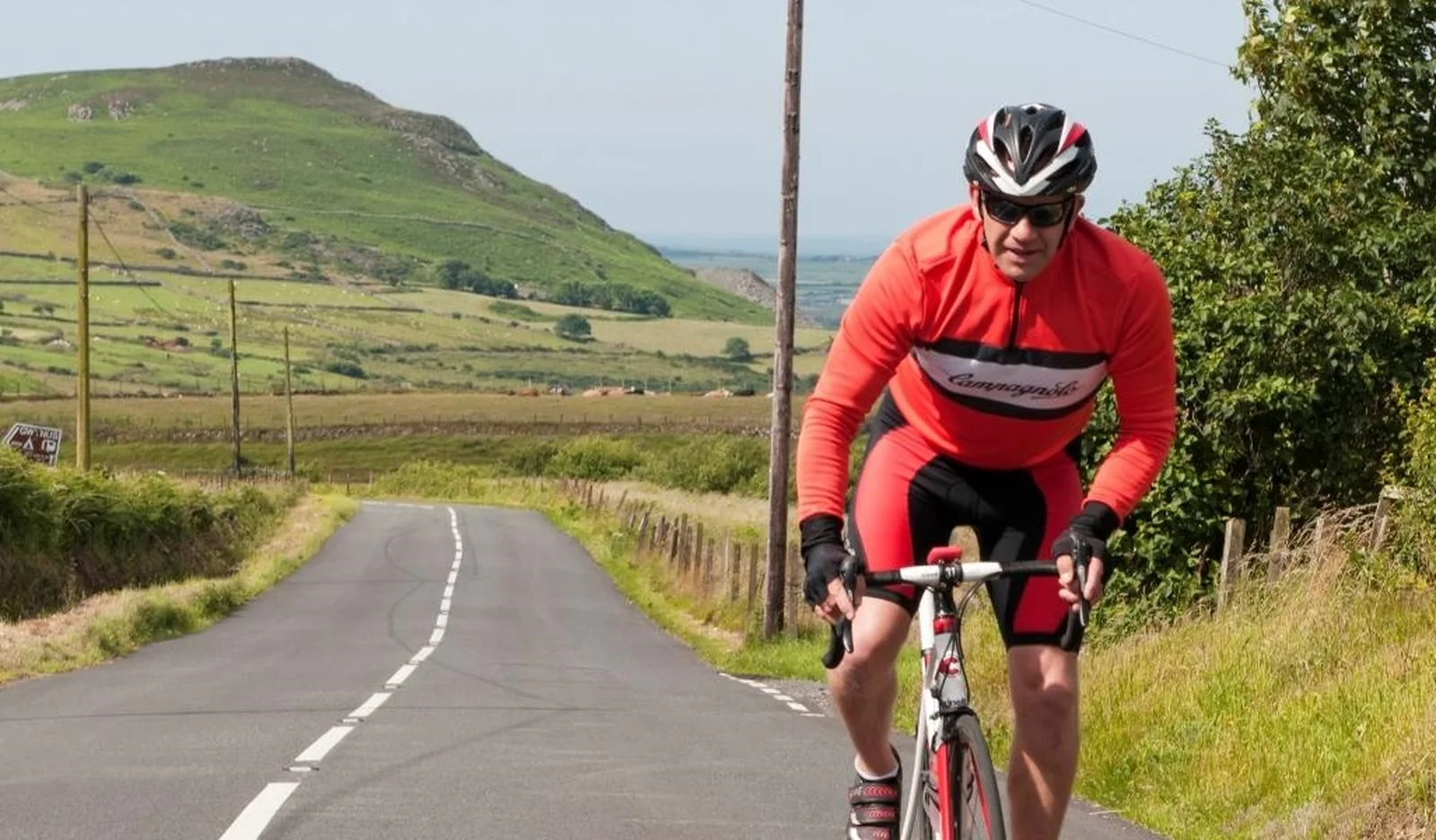 Cyclist on a coastal road on the Llŷn Peninsula