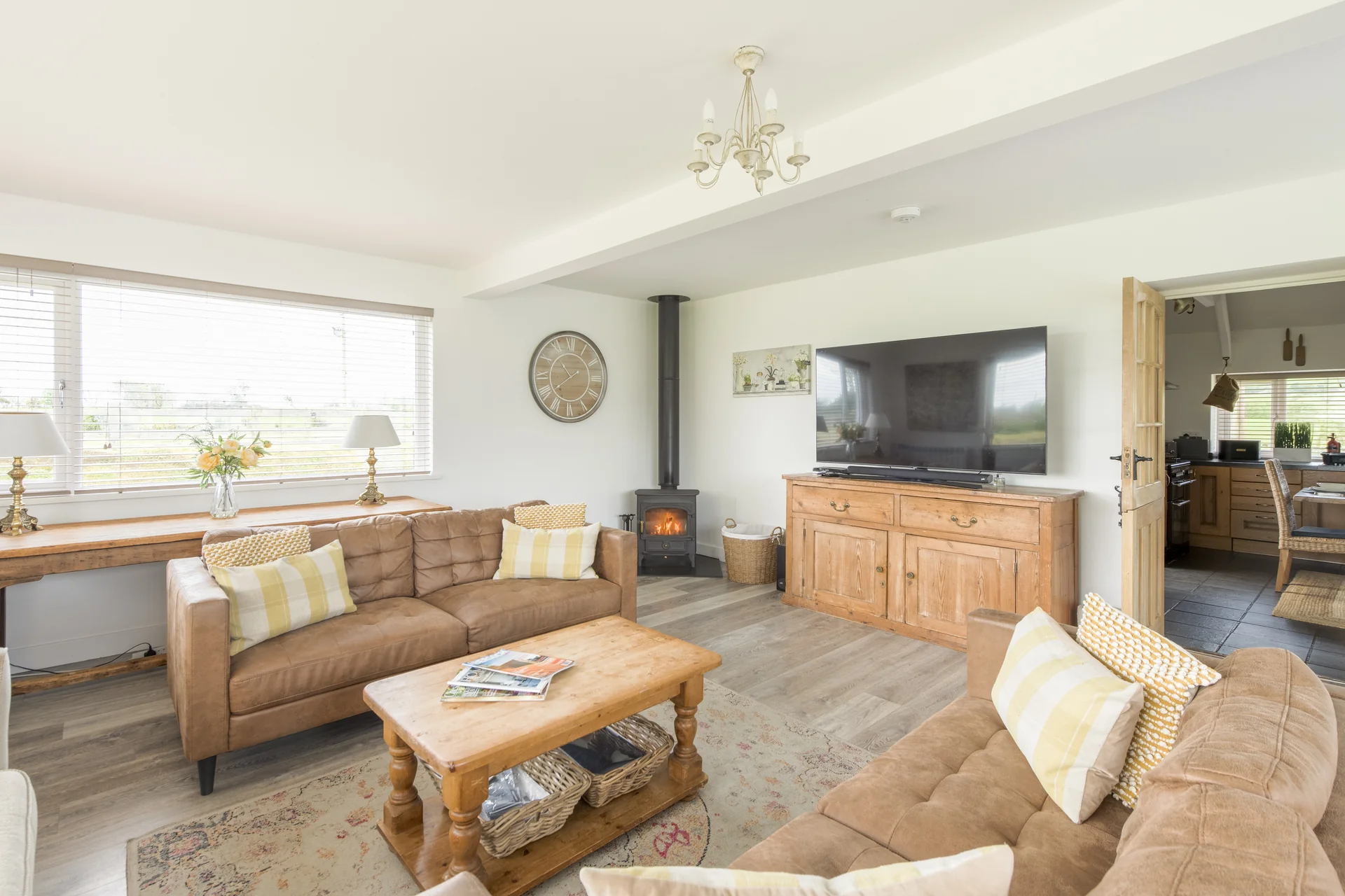 The main lounge at Tyn y Big Estate with its log burner and deep seating